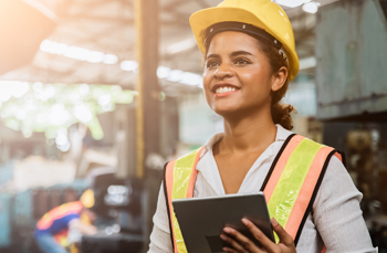 female construction worker holding clipboard