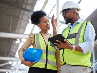two project managers discussing plans